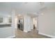 Open concept kitchen and living area with stainless steel appliances and wood-look flooring at 1014 Kansas St, Kannapolis, NC 28083