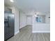 Open-concept living and dining area adjacent to the kitchen, with wood-look flooring at 1014 Kansas St, Kannapolis, NC 28083