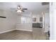 Living area open to the kitchen, with wood-look flooring and neutral paint at 1014 Kansas St, Kannapolis, NC 28083