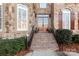 Brick front entrance with double doors and a stone facade at 10121 Enfield Ct, Fort Mill, SC 29707