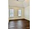 Spacious bedroom with dark brown wood flooring and high ceiling at 1364 Lloyd Nw Pl, Concord, NC 28027