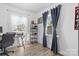 Home office featuring a desk, shelving, and large window at 1522 Princess Pl, Charlotte, NC 28208