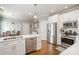 Modern kitchen with white cabinets, stainless steel appliances, and a large island at 180 Sink Farm Rd, Mooresville, NC 28115