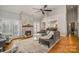 Spacious living room with a stone fireplace and hardwood floors at 180 Sink Farm Rd, Mooresville, NC 28115