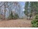 Spacious backyard with trees and ground cover at 1824 Pipers Ridge Nw Cir, Conover, NC 28613