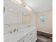 Bathroom with double vanity, marble countertop, and a shower at 1975 W Wall St, Wadesboro, NC 28170