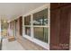 Front porch view with new windows and shutters at 1975 W Wall St, Wadesboro, NC 28170