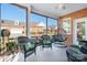 Relaxing screened porch with wicker furniture and tile flooring at 2284 Early Robin Dr, Denver, NC 28037