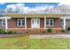 Brick front porch with white columns and steps at 240 Quail Dr, Salisbury, NC 28147