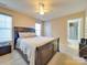 Bedroom with a dark brown sleigh bed at 2726 Thistle Brook Dr, Concord, NC 28027