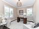 Elegant home office with built-in desk and neutral decor at 3227 Pinehurst Pl, Charlotte, NC 28209