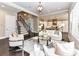 Open living area with a view into the kitchen and staircase at 3227 Pinehurst Pl, Charlotte, NC 28209