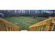 Spacious backyard with wooden deck and storage sheds at 3431 Polkville Rd, Shelby, NC 28150