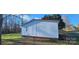 White sided house with red roof and small deck at 3431 Polkville Rd, Shelby, NC 28150