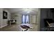 Living room with hardwood floors, stylish decor, and large windows at 3431 Polkville Rd, Shelby, NC 28150