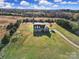 Aerial view of a house on a large lot with farmland in the background at 3798 Red Doc Rd, Lancaster, SC 29720