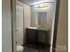 Bathroom with vanity, mirror, and toilet at 3804 Crossing Creek Dr, Claremont, NC 28610