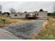 Mobile home with gravel driveway and mailbox at 3804 Crossing Creek Dr, Claremont, NC 28610