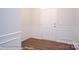 Bright entryway with hardwood floors and white wainscoting at 4153 Black Ct # 173, Harrisburg, NC 28075