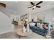 Open concept living room with kitchen view, stylish furniture, and hardwood floors at 5015 Westmead Ln, Charlotte, NC 28262