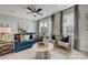 Bright living room with comfy seating, stylish decor, and large windows at 5015 Westmead Ln, Charlotte, NC 28262