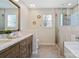 Elegant bathroom with double vanity, large shower, and soaking tub at 733 Kendall Green Rd, Fort Mill, SC 29715