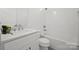 White bathroom with a shower/tub combo, single vanity, and tiled floor at 7673 Katherine Dr, Denver, NC 28037