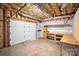 Unfinished basement workshop area with workbench and shelving at 807 Lauras Ln, Albemarle, NC 28001