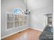 Bright breakfast nook with tile floors and a lovely chandelier at 807 Lauras Ln, Albemarle, NC 28001