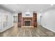 Living room with stone fireplace and built-in shelves at 807 Lauras Ln, Albemarle, NC 28001