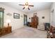 Bright bedroom with ceiling fan, wooden armoire, and lots of light at 10105 Bishops Gate Blvd, Pineville, NC 28134