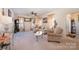 Spacious living room with light-colored furniture and large windows at 10105 Bishops Gate Blvd, Pineville, NC 28134