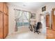 Home office features built-in wooden shelving and a window at 10105 Bishops Gate Blvd, Pineville, NC 28134