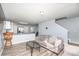 Living room features a gray couch, wood-look floors, and an open concept kitchen at 114 Four Andrews Dr, Harmony, NC 28634