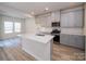 Modern kitchen with gray cabinets and white quartz island at 1271 31St Ne St, Conover, NC 28613