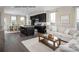 Open living room and kitchen area with hardwood floors and neutral decor at 2520 Rebecca Ave # 1020E, Charlotte, NC 28208