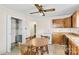 Galley kitchen with wood cabinets and small table at 300 Duke St, Great Falls, SC 29055