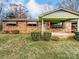 Brick ranch house with covered porch, landscaping, and a spacious yard at 313 Lake Montonia Rd, Kings Mountain, NC 28086