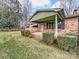 Brick ranch house with covered porch, landscaping, and a spacious yard at 313 Lake Montonia Rd, Kings Mountain, NC 28086
