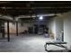 Unfinished basement area with storage and workout bench at 325 Hunter St, Salisbury, NC 28144