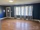 Living room with hardwood floors and blue walls at 325 Hunter St, Salisbury, NC 28144