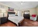 Main bedroom with hardwood floors and a ceiling fan at 7681 Orchard Park Cir, Harrisburg, NC 28075