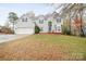 Two-story house with attached garage and landscaped lawn at 7681 Orchard Park Cir, Harrisburg, NC 28075