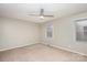 Spacious bedroom with plush carpeting, ceiling fan, and windows at 1284 Ebenezer Rd, Rock Hill, SC 29732