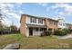 Townhouse exterior with brick and siding, front door, and grassy yard at 1284 Ebenezer Rd, Rock Hill, SC 29732