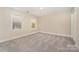 Bright bedroom with carpet and two windows at 14637 S Brent Dr, Huntersville, NC 28078