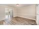 Neutral-toned dining room with hardwood floors and wainscoting at 14637 S Brent Dr, Huntersville, NC 28078