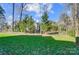 Private backyard with lush green lawn and mature trees at 2315 Smith Harbour Dr, Denver, NC 28037