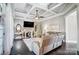 Living room with coffered ceiling, fireplace, and comfy sectional sofa at 2315 Smith Harbour Dr, Denver, NC 28037