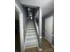 Gray and white staircase leading to the upper level of the home at 3274 Heathstead Pl, Charlotte, NC 28210